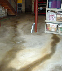 Flooding entering a basement through a floor crack