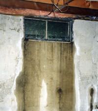 Flooding through basement windows in a home.
